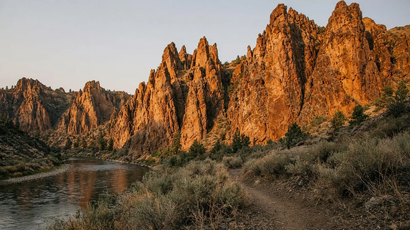 Smith Rock's golden spires above a quiet river