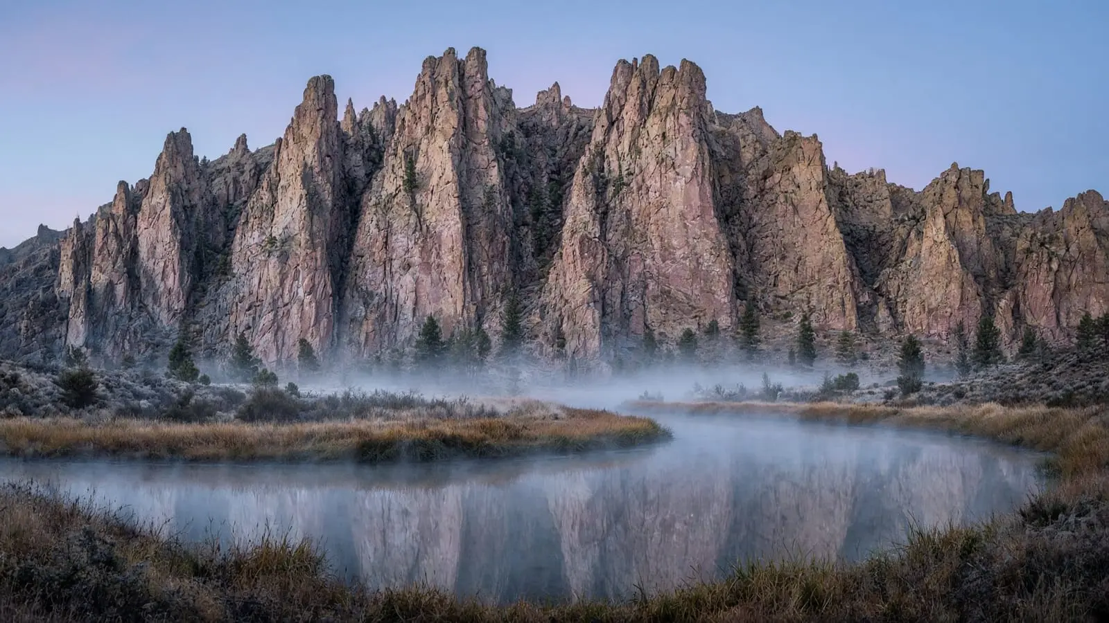 Smith Rock above a misty river at dawn